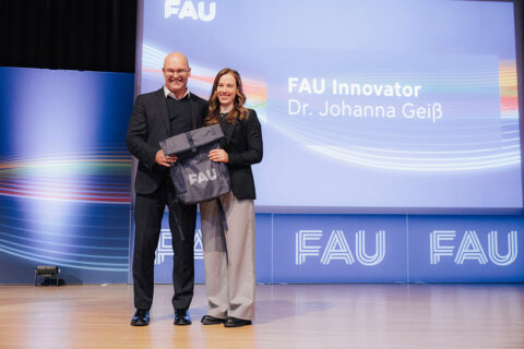 The FAU Dies Academicus 2025: FAU Innovator Dr. Johanna Geis (right) and VP Research Georg Schett. (Image: FAU/Giulia Iannicelli)